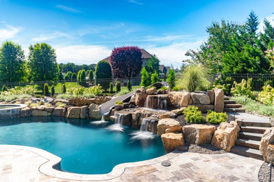 M Brown - Forrest Hills, MD - A beautiful backyard with a swimming pool and a waterfall feature