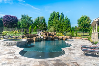 M Brown - Forrest Hills, MD - A beautiful backyard with a swimming pool and a waterfall feature