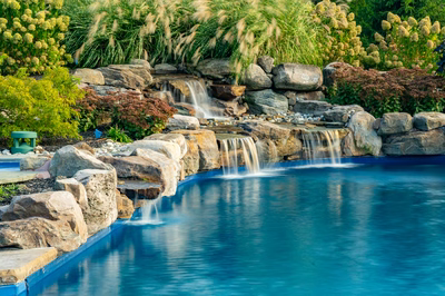 Morris W - New Hope, PA - A beautiful garden with a waterfall and a blue pool surrounded by rocks and plants