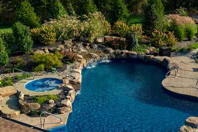 Morris W - New Hope, PA - A swimming pool surrounded by lush greenery and a waterfall.