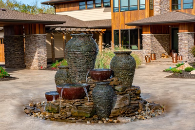 Maruyama - New Hope, PA - A large stone fountain in front of a large building.