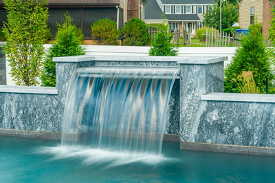 Memorial D - Cherry Hill, NJ - A water feature in a backyard setting with houses in the background