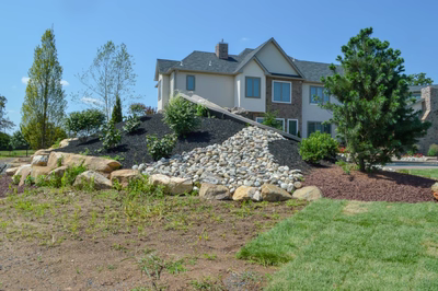 Miners H - Flemington, NJ - A large house with a large pile of rocks in front of it