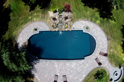 Mist B - Marlboro, NJ - A bird's eye view of a swimming pool surrounded by lush greenery