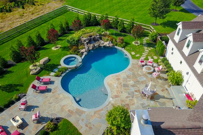 Moran D - Millstone, NJ - A bird's eye view of a backyard with a swimming pool surrounded by lush green grass and landscaping