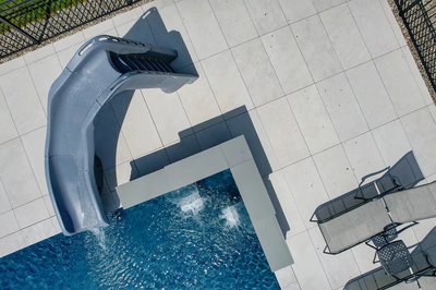 Mossbrae J - Millstone, NJ - A view from above of a swimming pool with a water feature and lounge chairs