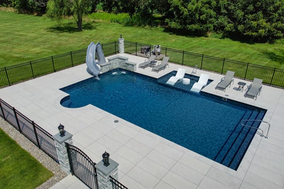Mossbrae O - Millstone, NJ - A rectangular swimming pool surrounded by a black fence and lush green grass.