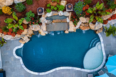 Munising N - Randolph, NJ - A bird's eye view of a backyard with a swimming pool surrounded by plants and flowers