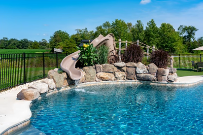 Swimming pool with a natural stone slide and water feature, Monroeville, NJ