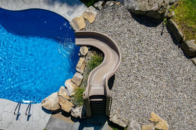 Myojin K - Sparta, NJ - A swimming pool with a water feature and a water slide