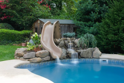 Nena A - Middleton, NJ - A backyard pool with a water feature and a slide
