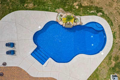 Okere I - Freehold, NJ - A bird's eye view of a swimming pool surrounded by grass and landscaping
