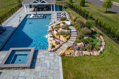 Otaki O - Ivyland, PA - A bird's eye view of a backyard with a swimming pool and landscaping