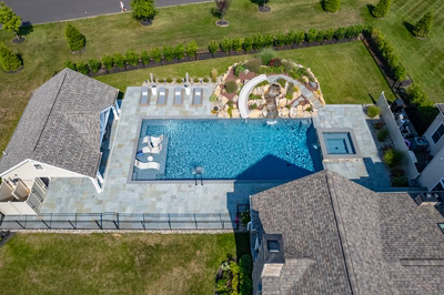 Otaki P - Ivyland, PA - A bird's eye view of a backyard with a swimming pool and landscaping