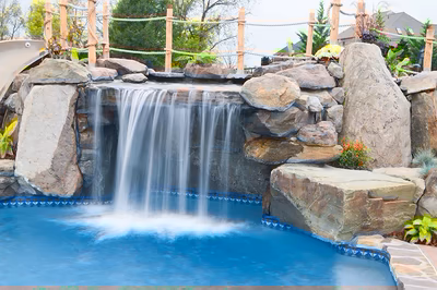 Paluth-G - Two men working on a concrete pool in a backyard.