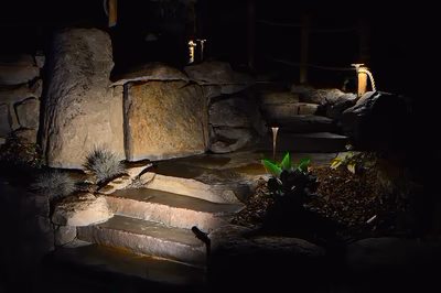 Paluth-Q - Two men working on a concrete pool in a backyard.