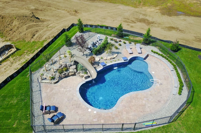 Pearl G - Lincroft, NJ - A bird's eye view of a backyard with a swimming pool and a play area