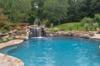 Prenn-A - A backyard with a swimming pool and a water slide