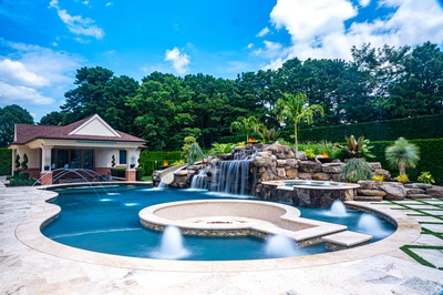 Richetli F - Monroe, NJ - A beautiful backyard with a swimming pool and a waterfall feature
