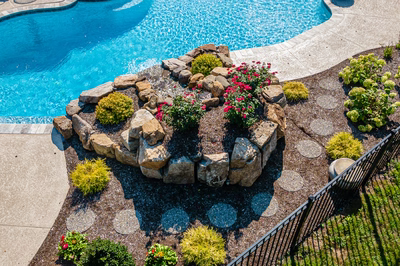 Ryuzu H - Collegeville, PA - A bird's eye view of a swimming pool surrounded by landscaping with rocks and flowers