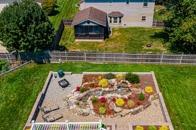 Sendo I - Sewell, NJ - A bird's eye view of a backyard with a rock garden and a fire pit