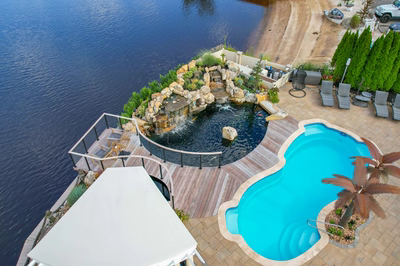 Shebelle - Hammonton, NJ - A bird's eye view of a backyard with a swimming pool and a water feature