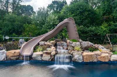 Shomyo B - Princeton Junction, NJ - A pool with a water feature and a slide in a backyard setting