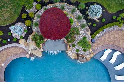 Sisiyi N - Manalapan, NJ - A bird's eye view of a backyard with a swimming pool and landscaping