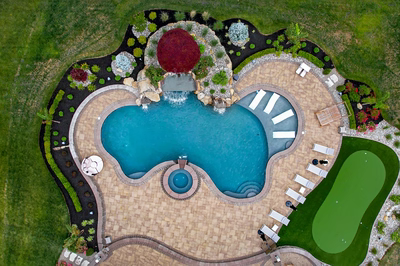 Sisiyi N - Manalapan, NJ - A bird's eye view of a backyard with a swimming pool and landscaping