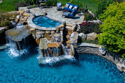 Spirit N - Cream Ridge, NJ - A beautiful backyard with a swimming pool and waterfall feature