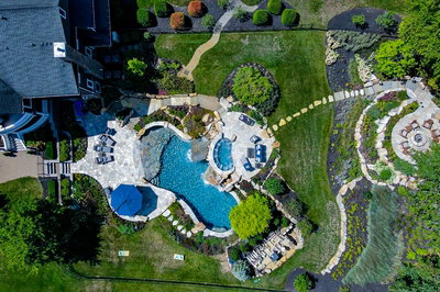 Spirit S - Cream Ridge, NJ - A bird's eye view of a backyard with a swimming pool surrounded by lush greenery