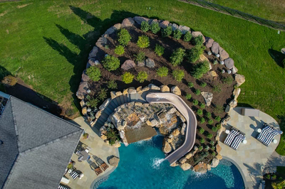 Tchupala O - Medford, NJ - A bird's eye view of a backyard with a swimming pool and a water feature