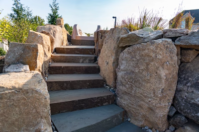 Tchupala Q - Medford, NJ - A set of stone stairs leading up to a house in the background