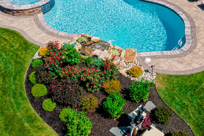 Thika I - Berlin, NJ - A bird's eye view of a backyard with a swimming pool surrounded by landscaping