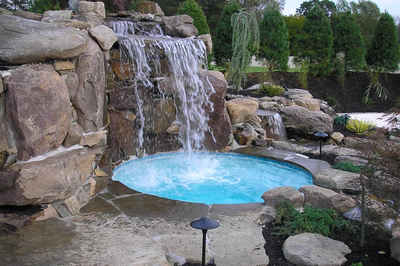 Tiger D - Sicklerville, NJ - A small pool with a waterfall in the middle surrounded by rocks and greenery