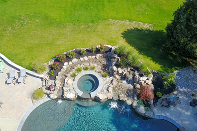 Tufa F - Medford, NJ - A bird's eye view of a backyard with a swimming pool and a waterfall feature