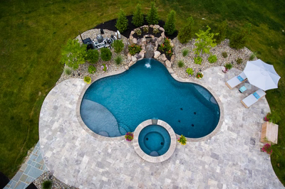 Willey E - Moorestown, NJ - A bird's eye view of a swimming pool surrounded by lush greenery and a stone patio