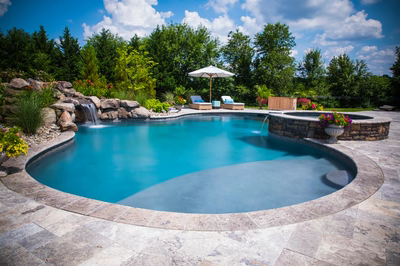 Willey F - Moorestown, NJ - A beautiful backyard with a swimming pool surrounded by lush greenery and flowers