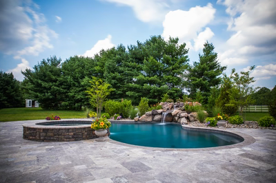 Willey G - Moorestown, NJ - A beautiful backyard with a swimming pool surrounded by lush greenery and flowers