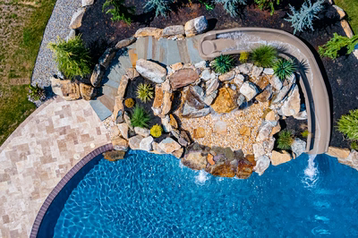 Yakso L - Mullica Hill, NJ - A bird's eye view of a backyard with a swimming pool and a waterfall