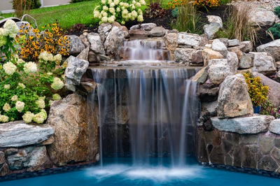 Yosemite D - Newtown Square, PA - A beautiful backyard with a waterfall surrounded by rocks and flowers