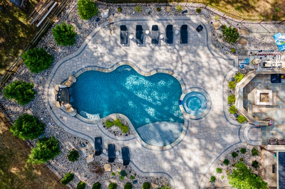 Zealand K - Lutherville, MD - A bird's eye view of a backyard with a swimming pool surrounded by landscaping