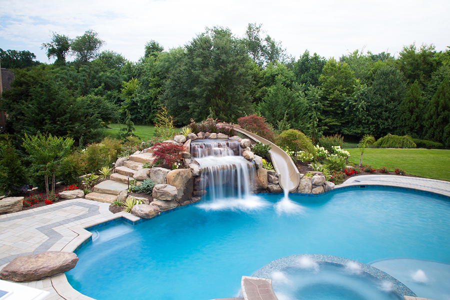 waterfall that cascades over a large pool grotto combined with an ultimate ...